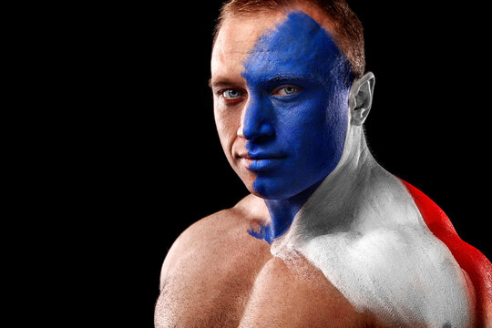 France fan. Flag of French Republic. Soccer or football athlete with flag bodyart on face. Sport concept with copyspace.