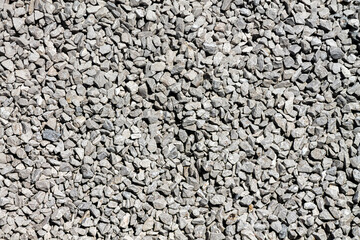 Background of crushed gray stone gravel. Adobe RGB color space.