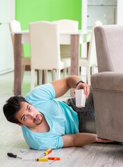 Man repairing furniture at home