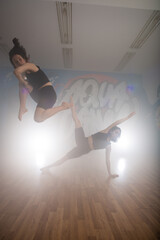 Group of multiracial dancers are exercising and practicing in their studio in slow motion
