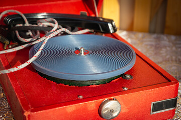 An old turntable made of vinyl. © Ilya