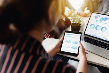 Business planning meeting, colleagues sitting together at the table in office