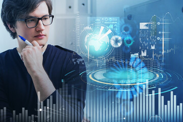 Businessman with pen in hand, digital interface with globe and financial icons