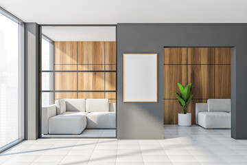 Gray and wooden office waiting room with vertical poster