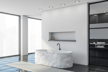 Fototapeta na wymiar White and gray bathroom corner with tub, window and sink