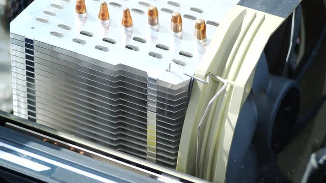 Man clean up dirty CPU fan inside computer. Dust pollution.