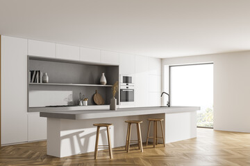 Light kitchen interior with dining table and chairs on wooden floor, window