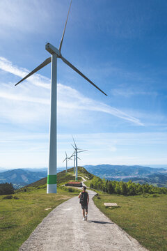 Young caucasian man near windmills at the top of Oiz mountain; Basque Country.
