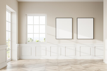 Two vertical framed mock up posters in empty white room with windows