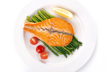 Grilled salmon butterfly and asparagus on a white plate