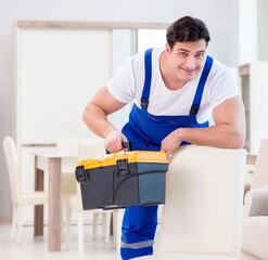 Furniture repairman working in store