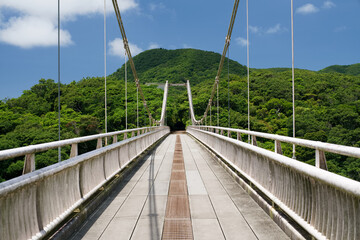 Okinawa,Japan - May 24, 2021: A suspension bridge over Ishigaki dam lake in Ishigaki island, Okinawa, Japan
