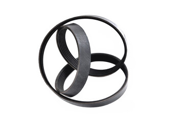 A new belt for a poly-V-ribbed electric generator. Car timing belt. White background close-up