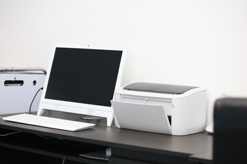Office equipment, computer and printer for office bussiness - Powered by Adobe