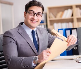 Businessman receiving letter in the office