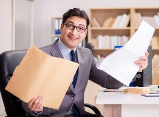 Businessman receiving letter in the office