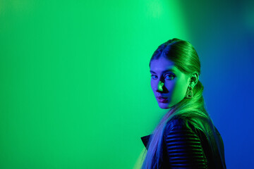 Neon light woman. Advertising background. Futuristic beauty. Green blue glow mysterious girl in...