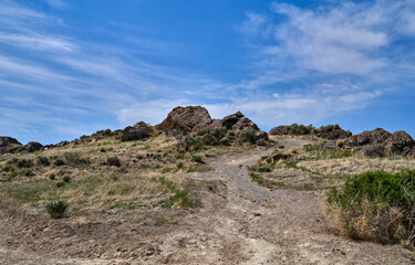 Fototapeta premium Scenic View of Utah Desert Mountain Rocky landscape with blue skies and White Clouds 