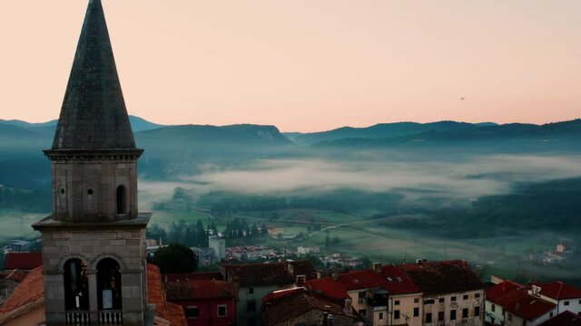 Misty Hills With Parish Church of the Blessed Virgin Mary On Old Stari Grad Town At Buzet During Hazy Morning In Istria, Croatia. - Aerial Shot