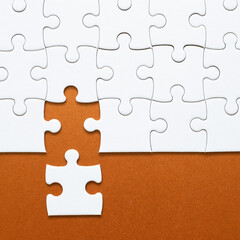 Fototapeta premium Set of white puzzle pieces and last one piece