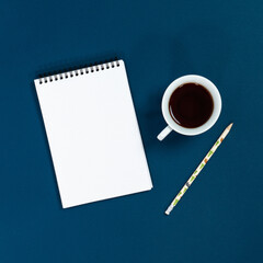Blank notebook with coffee