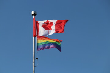 Showing pride in Canada pride flag  with Canadian flag