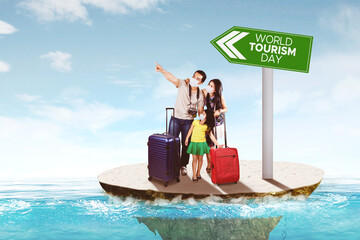 Obraz premium Happy family pointing at world tourism day text