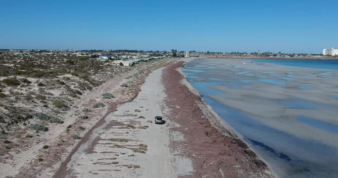 Following a car as it drives along North Beach in Wallaroo South Australia