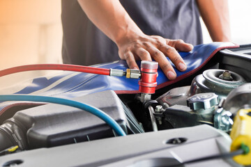 fill car air conditioner,Servicing car air conditioner. Service station. Car repair.