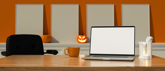 Laptop with mock-up screen on the table in the room decorated with halloween decorations, 3D rendering