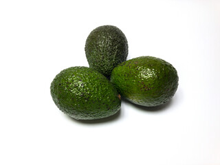 three avocados isolated on white background