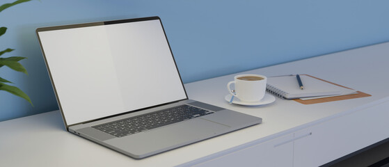 Laptop with mock-up screen on white table with coffee up and stationery, 3D rendering