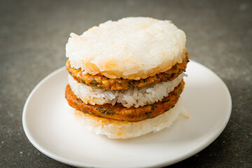 grilled spicy pork and herbs with  sticky rice burger