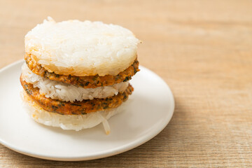 grilled spicy pork and herbs with  sticky rice burger