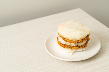 grilled spicy pork and herbs with  sticky rice burger
