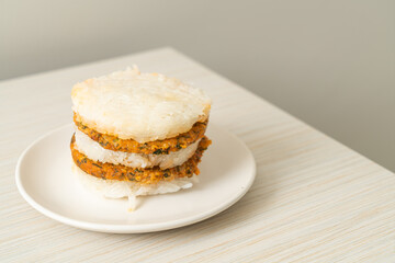 grilled spicy pork and herbs with  sticky rice burger