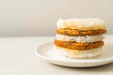 grilled spicy pork and herbs with  sticky rice burger