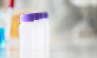 Colorful water and liquid in beager and test tube in laboratory.