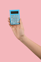 Woman with calculator on color background