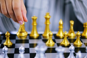 Businessman play with chess game. success management concept of business strategy and tactic...