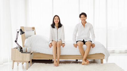 LGBTQ couple lovers, a handsome girl as man or butch and femme, spending and sharing loving time in...