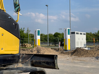 some Charging columns for electric vehicles are installed on the premises of a gas station
