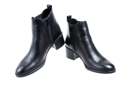 Pair of ladies fashion black leather heeled boots, on white background