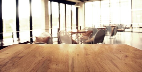 Empty wooden table in front of abstract blurred background of coffee shop . can be used for display or montage your products.Mock up for display of product