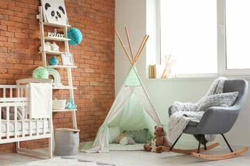 Stylish interior with modern armchair in children's room