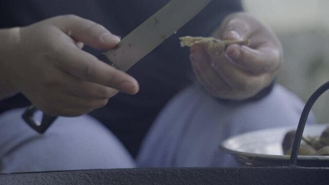 Close up: Wild mushrooms added to wok with Manipur chicken chutney