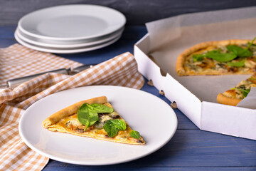 Composition with slice of tasty vegetarian pizza on wooden background