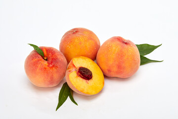Fresh peaches and leaves