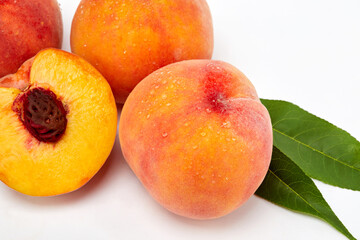 Fresh peaches and leaves