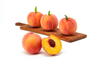 Fresh peaches and leaves